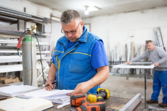Workshop foreman looking at the technical drawings